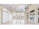 Bright sunroom features a vaulted ceiling, skylights and serene views at 8804 Waterside Dr, Indianapolis, IN 46278