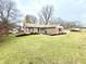 Inviting front yard with a brick walkway leading to the entrance at 100 W Hillsboro Dr, Pendleton, IN 46064