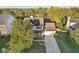 Aerial view of a house with a large tree and fenced backyard at 1140 Scarlet Quarry Cir, Avon, IN 46123