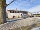 Charming two-story home with a small front deck and dusting of snow at 1405 Woodbine Dr, Anderson, IN 46011