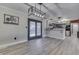 Dining area with modern light fixture and view into the kitchen at 1749 N Blue Bluff Rd, Martinsville, IN 46151