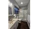 Bathroom with a shower, toilet, and vanity, featuring dark wood-look flooring at 2039 Round Barn Ct, Anderson, IN 46017