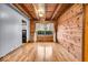 Dining room with exposed beams, wood paneling, and hardwood flooring at 2198 N Hickory Blvd, Greenfield, IN 46140