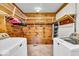 Laundry room with washer, dryer, and ample shelving at 2198 N Hickory Blvd, Greenfield, IN 46140