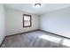 Empty bedroom with carpet flooring, neutral walls, and a single window at 2604 Albert St, Anderson, IN 46012