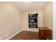 Small bedroom with wood-look flooring and a wall-mounted tapestry at 3149 Manor Ct, Indianapolis, IN 46218