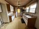 Kitchen with wood cabinets and pink flooring at 3329 Bethel Ave, Indianapolis, IN 46203