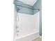 White and clean bathtub with curved shower rod in a simple bathroom at 3458 N Kenwood Ave, Indianapolis, IN 46208