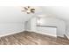 Bedroom with vaulted ceilings, wood-look floors, ceiling fan, and half wall at 3458 N Kenwood Ave, Indianapolis, IN 46208