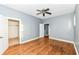 Spacious bedroom featuring hardwood floors, a ceiling fan, and ample closet space at 3458 N Kenwood Ave, Indianapolis, IN 46208