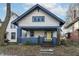 Charming two-story home with a blue and white exterior and a bright yellow front door at 3458 N Kenwood Ave, Indianapolis, IN 46208