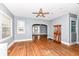 Living room with hardwood floors, an archway, and a view of the adjacent living area at 3458 N Kenwood Ave, Indianapolis, IN 46208