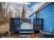 Back deck with lattice panels and steps leading down at 3831 Ireland Dr, Indianapolis, IN 46235