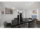 Virtually staged dining room with a modern table and chairs at 3831 Ireland Dr, Indianapolis, IN 46235