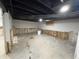 Unfinished basement with exposed walls and concrete floor at 3919 E 34Th St, Indianapolis, IN 46218