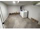 Unfinished basement with washer, dryer, and some exposed walls at 3919 E 34Th St, Indianapolis, IN 46218