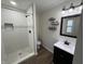Updated bathroom with walk-in shower, new vanity, and modern fixtures at 3919 E 34Th St, Indianapolis, IN 46218