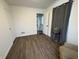 Cozy bedroom with wood-look flooring and access to exterior at 3919 E 34Th St, Indianapolis, IN 46218