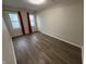 Well-lit bedroom with hardwood floors and neutral-colored walls at 3919 E 34Th St, Indianapolis, IN 46218