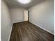 Spacious bedroom featuring hardwood floors and an adjacent bathroom at 3919 E 34Th St, Indianapolis, IN 46218