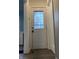 Bright entryway with white door and wood-look flooring at 3919 E 34Th St, Indianapolis, IN 46218