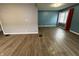 Spacious living room featuring hardwood floors and two-toned walls at 3919 E 34Th St, Indianapolis, IN 46218