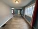 Bright living room with hardwood floors and large windows at 3919 E 34Th St, Indianapolis, IN 46218