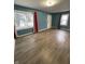 Living room with wood floor and blue walls at 3919 E 34Th St, Indianapolis, IN 46218