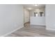 Upstairs hallway with gray walls, vinyl flooring, and doors to bedrooms at 4086 Lassen Ln, Indianapolis, IN 46235