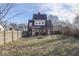 Fenced backyard with a grassy area and a swing set at 550 W Jefferson St, Franklin, IN 46131