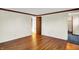 Empty bedroom with hardwood floors, closet, and white walls at 5621 Sugar Hills Dr, Greenfield, IN 46140