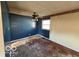 Vacant bedroom with blue walls, wood floor, and ceiling fan at 608 Manhattan Ave, Indianapolis, IN 46241