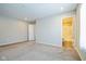 Spacious bedroom with carpet and access to bathroom at 610 Atlas Dr, Lebanon, IN 46052