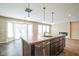 Modern kitchen island with sink, dishwasher, and breakfast bar at 610 Atlas Dr, Lebanon, IN 46052