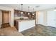 Modern kitchen with island, stainless steel appliances, and dark brown cabinets at 610 Atlas Dr, Lebanon, IN 46052