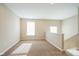 Spacious loft area with carpet and windows at 610 Atlas Dr, Lebanon, IN 46052