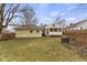 Backyard with raised garden beds, a storage shed, and a fenced yard at 6440 Maple St, Indianapolis, IN 46236