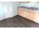 Simple kitchen with light wood cabinets and vinyl flooring at 10028 Hawkins Ct, Indianapolis, IN 46229