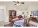 Dining room with a round table and wooden hutch at 1036 Laurelwood Ln, Greenwood, IN 46142