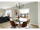 Bright dining area with glass table, leather chairs, and a view at 11710 Cotterill Way, Indianapolis, IN 46235