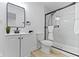 Modern bathroom with white vanity, marble-tiled shower, and updated fixtures at 1176 Udell St, Indianapolis, IN 46208