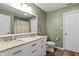 Bathroom with double vanity and a white toilet at 13209 Westwood Ln, Fishers, IN 46038