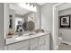 Double vanity bathroom with modern finishes and a large mirror at 1490 Chatham Village Blvd, Westfield, IN 46074