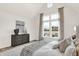 Bright bedroom with large windows and a dresser at 1490 Chatham Village Blvd, Westfield, IN 46074