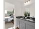 Modern bathroom with double vanity and gray cabinets at 1867 Vista Ridge Dr, Greenwood, IN 46143