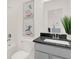 Clean bathroom with gray vanity and black countertop at 1867 Vista Ridge Dr, Greenwood, IN 46143