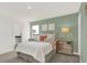 Bedroom with a queen bed, soft green walls, and ensuite bathroom at 1867 Vista Ridge Dr, Greenwood, IN 46143