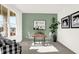 Bright home office features a wood desk, large window, and an accent wall at 1867 Vista Ridge Dr, Greenwood, IN 46143