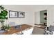 Home office with wood desk, window, and view of entryway at 1867 Vista Ridge Dr, Greenwood, IN 46143