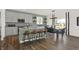 Island kitchen features stainless steel appliances and breakfast bar at 1867 Vista Ridge Dr, Greenwood, IN 46143